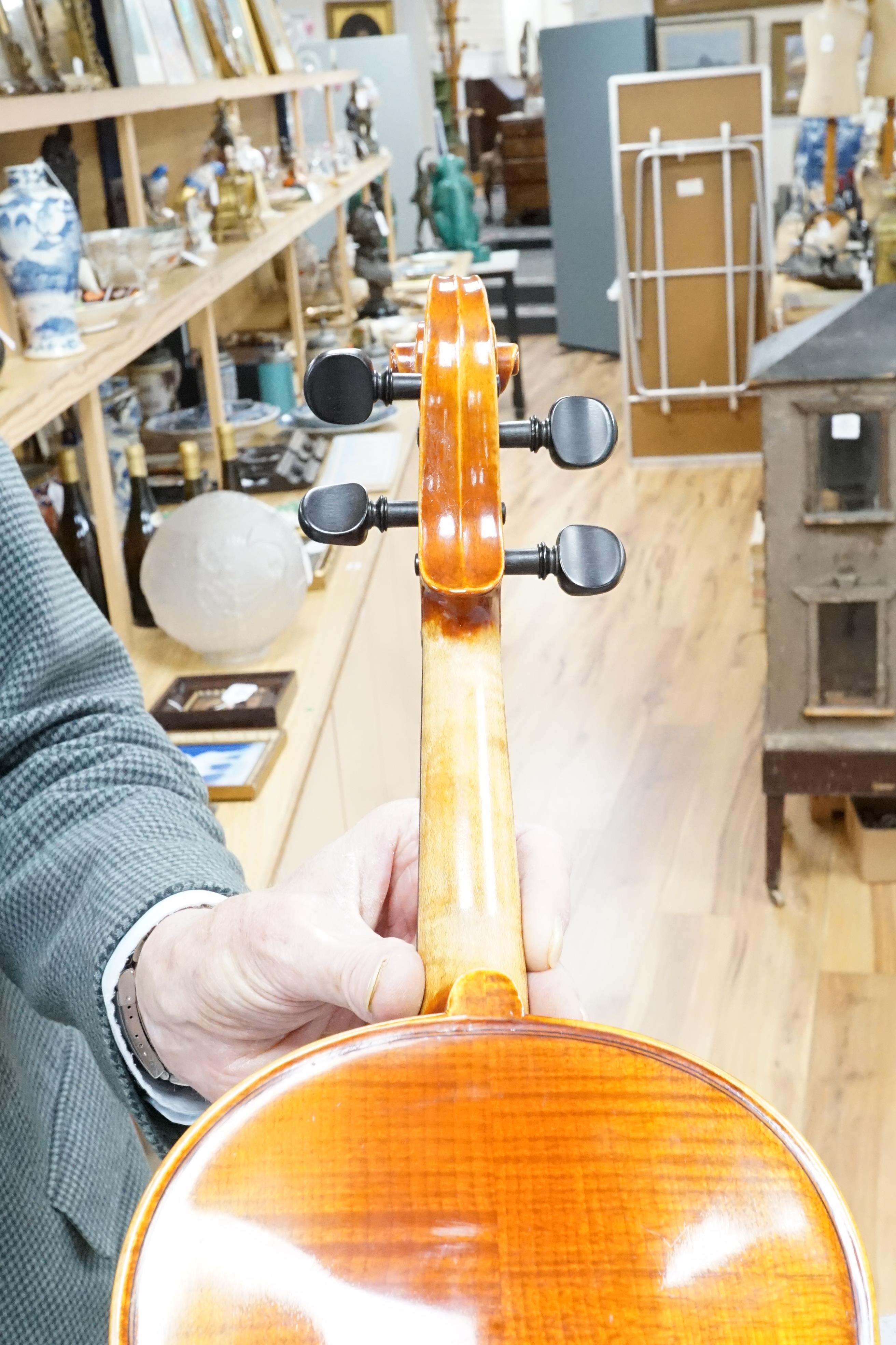 A violin, in fitted case (German)